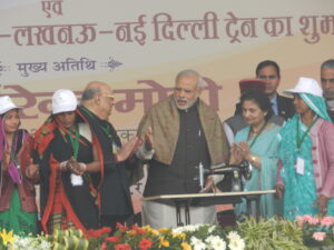 PM giving Sewing Machine to widows